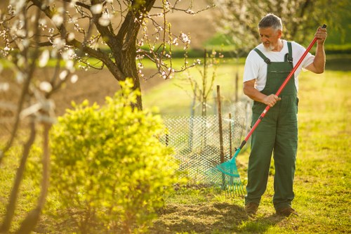 Professional lawn mower working on a Green Lawn in Hornsey
